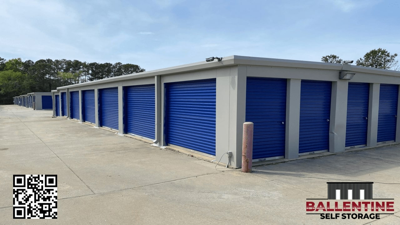 Well-lit gated storage facility at night with secure entry and cameras
