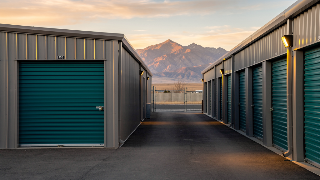 Drive-up 10x10 storage unit on a lit aisle at a fenced Payson facility