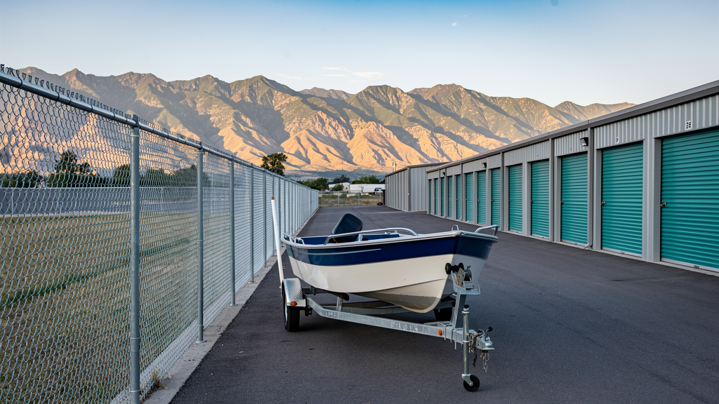 Boat and trailer parked on land at Sunset Storage Centers for the off-season