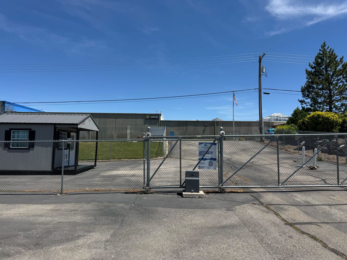 Chain-link gate and fence at the entrance of Sunset Storage Centers
