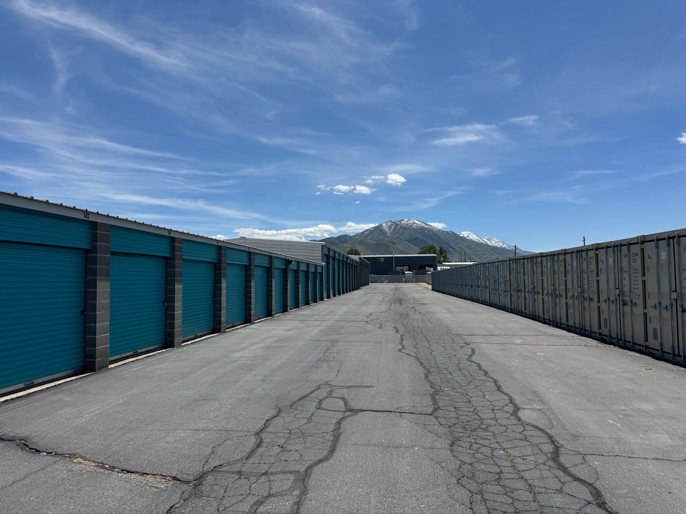 Drive-up storage units at Sunset Storage Centers in Payson with a wide paved aisle